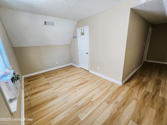 611 Malcolm Ave, Louisville, KY 40223 - bonus room featuring hardwood / wood-style flooring, a textured ceiling, and lofted ceiling