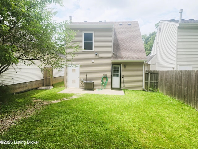 611 Malcolm Ave, Louisville, KY 40223 - rear view of house with a patio area, a fenced backyard, and roof with shingles