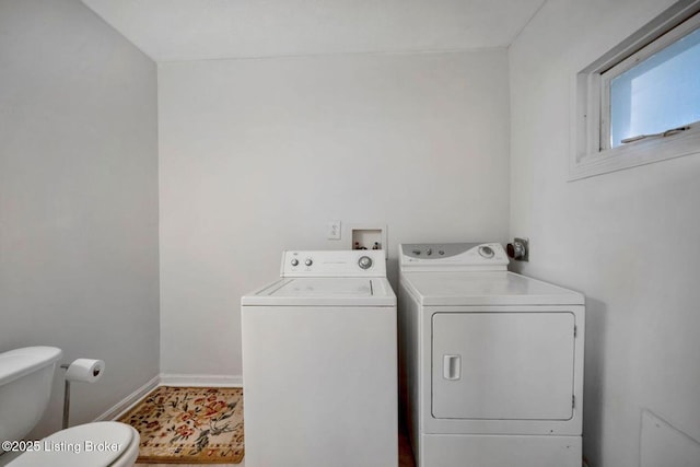 2060 S Preston St, Louisville, KY 40217 - washroom featuring washing machine and dryer and baseboards