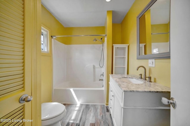 2060 S Preston St, Louisville, KY 40217 - full bathroom with toilet, vanity, wood finished floors, and shower / tub combination