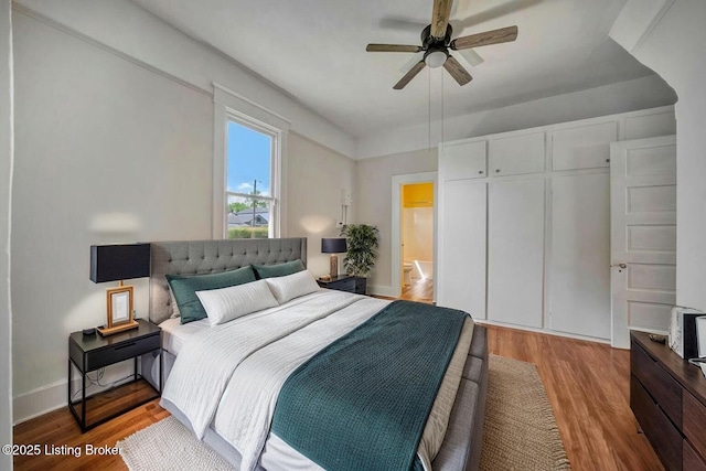 2060 S Preston St, Louisville, KY 40217 - bedroom with light wood-style floors, a closet, baseboards, and a ceiling fan
