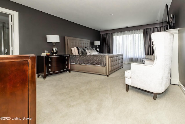 carpeted bedroom featuring vaulted ceiling