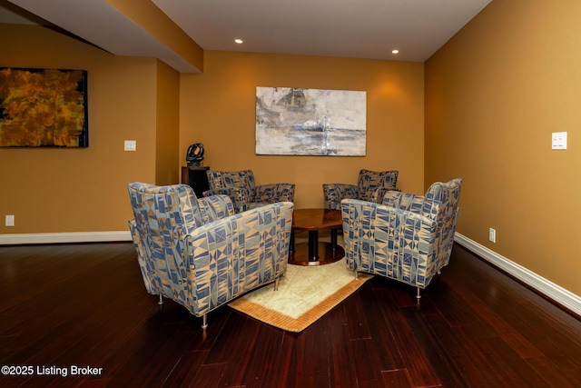 living area with recessed lighting, baseboards, and wood finished floors