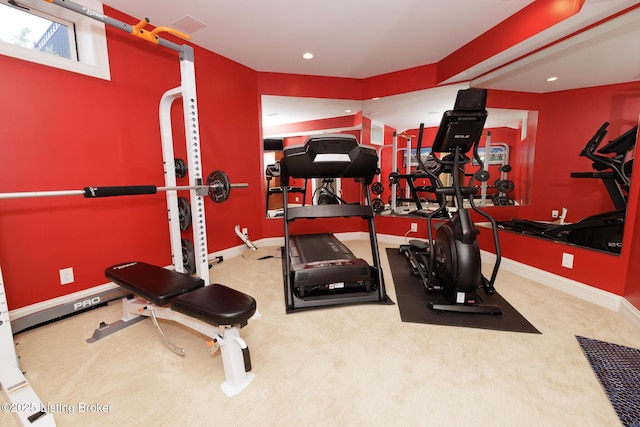 workout area with baseboards, visible vents, and recessed lighting