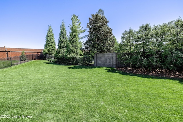 view of yard featuring fence