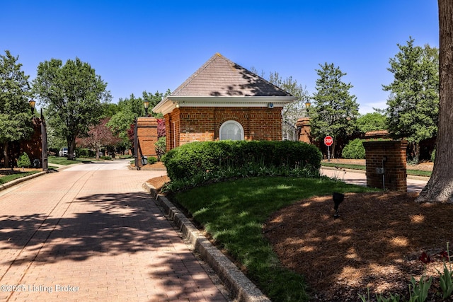 view of property exterior featuring brick siding