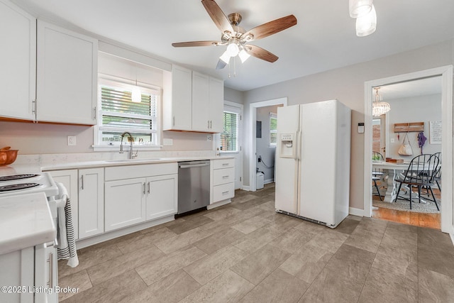 4203 Hewitt Ave, Louisville, KY 40220 - kitchen with white appliances, a sink, ceiling fan, light countertops, and white cabinets