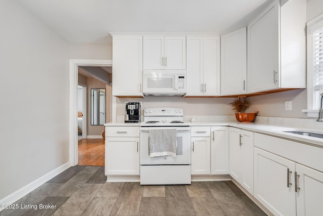 4203 Hewitt Ave, Louisville, KY 40220 - kitchen with white appliances, a sink, light countertops, and white cabinetry