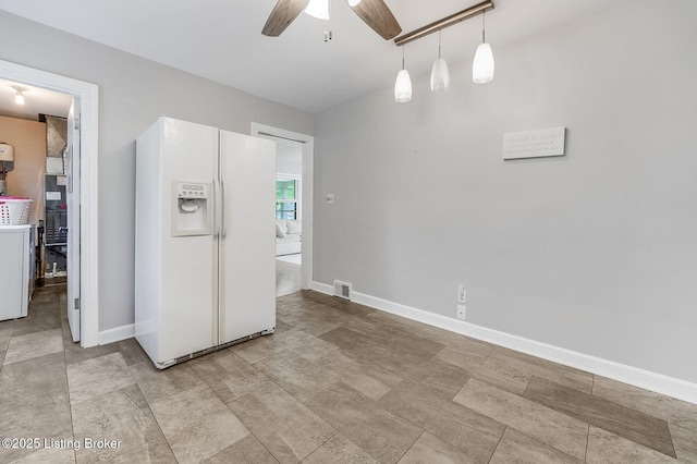 4203 Hewitt Ave, Louisville, KY 40220 - kitchen with white refrigerator with ice dispenser, ceiling fan, baseboards, and hanging light fixtures