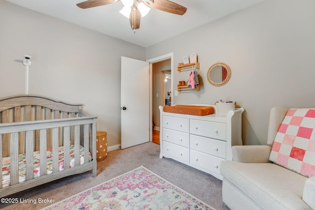 4203 Hewitt Ave, Louisville, KY 40220 - carpeted bedroom featuring a nursery area, a ceiling fan, and baseboards