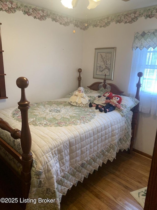 bedroom with wood finished floors