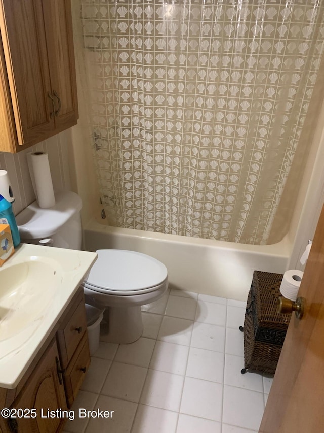 bathroom with vanity, toilet, tile patterned flooring, and shower / bath combo
