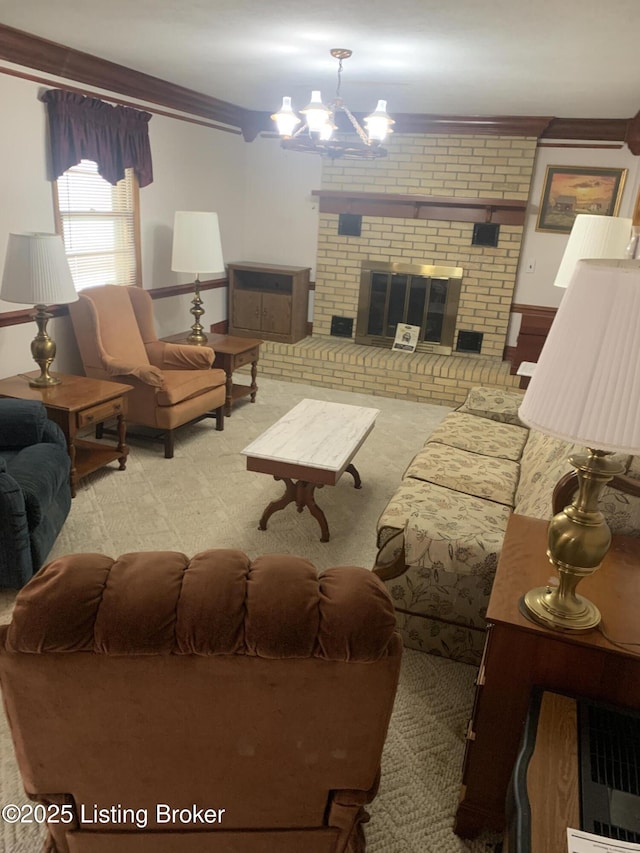 living room featuring carpet flooring, an inviting chandelier, and a fireplace