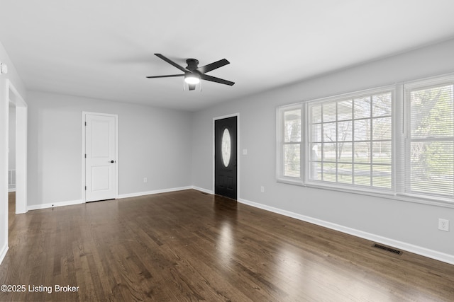 6487 New Glendale Rd, Glendale, KY 42740 - entrance foyer with ceiling fan, visible vents, dark wood-style flooring, and a healthy amount of sunlight