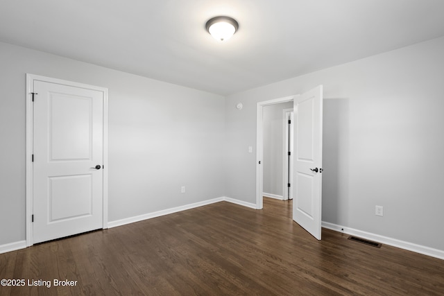 6487 New Glendale Rd, Glendale, KY 42740 - empty room with visible vents, wood finished floors, and baseboards