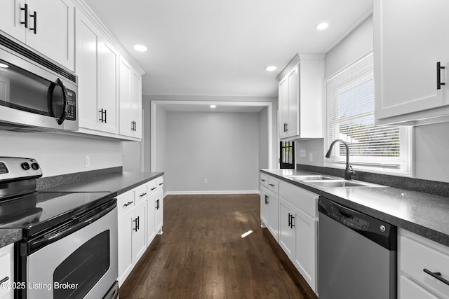 6487 New Glendale Rd, Glendale, KY 42740 - kitchen with recessed lighting, dark wood-style flooring, a sink, dark countertops, and appliances with stainless steel finishes