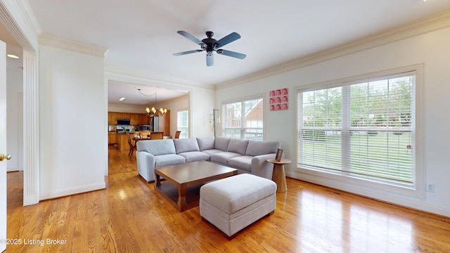 10513 Mountain Ash Ln, Prospect, KY 40059 - living area featuring ornamental molding, a chandelier, light wood-style floors, a ceiling fan, and baseboards