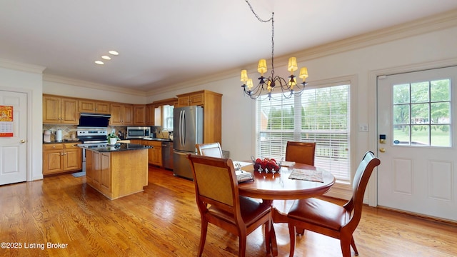 10513 Mountain Ash Ln, Prospect, KY 40059 - dining space featuring a chandelier, ornamental molding, light wood-style flooring, and recessed lighting