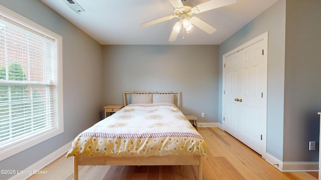 10513 Mountain Ash Ln, Prospect, KY 40059 - bedroom with wood finished floors, multiple windows, baseboards, and a closet