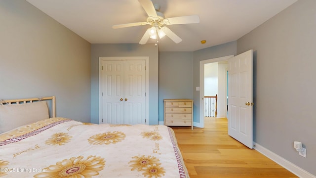 10513 Mountain Ash Ln, Prospect, KY 40059 - unfurnished bedroom featuring light wood finished floors, a closet, baseboards, and a ceiling fan