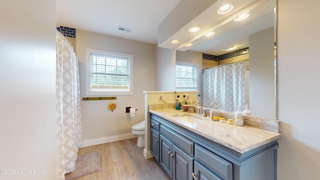 10513 Mountain Ash Ln, Prospect, KY 40059 - full bathroom featuring toilet, baseboards, vanity, wood finished floors, and recessed lighting