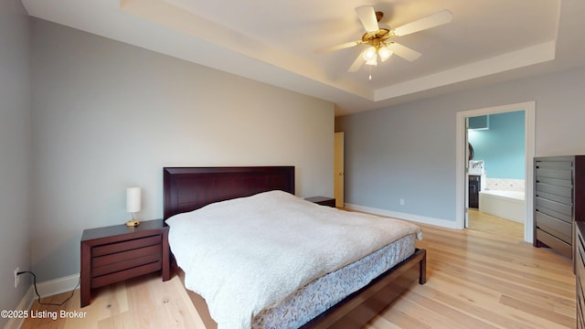 10513 Mountain Ash Ln, Prospect, KY 40059 - bedroom with a raised ceiling, baseboards, and light wood-style flooring