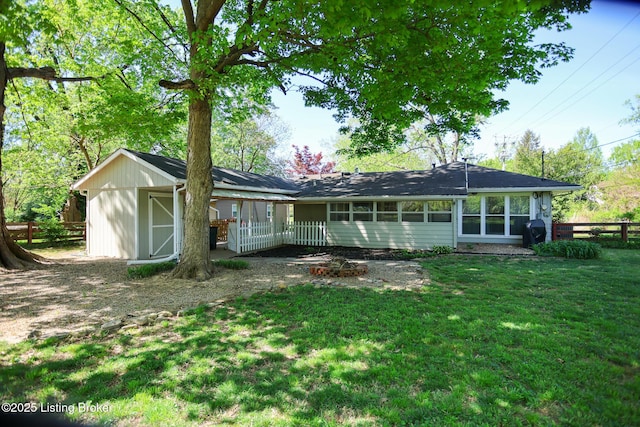 3101 Radiance Rd, Louisville, KY 40220 - back of property featuring a storage shed and an outbuilding