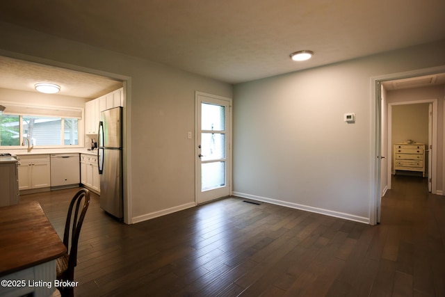3101 Radiance Rd, Louisville, KY 40220 - unfurnished dining area featuring baseboards, dark wood-style floors, and a sink