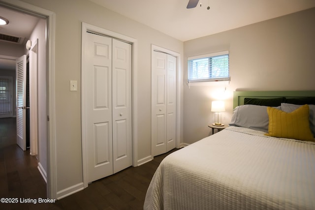3101 Radiance Rd, Louisville, KY 40220 - bedroom with multiple closets, dark wood-style floors, baseboards, and a ceiling fan