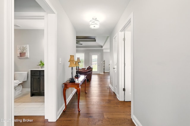 105 Hollow Springs Dr, Bardstown, KY 40004 - hallway with baseboards, a raised ceiling, and wood finished floors