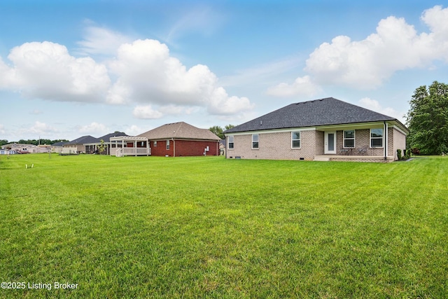 105 Hollow Springs Dr, Bardstown, KY 40004 - back of house featuring a yard and brick siding