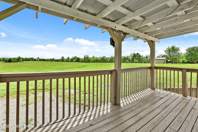 wooden terrace with a lawn