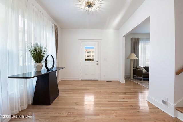 1245 S 7th St, Louisville, KY 40203 - entrance foyer with healthy amount of natural light, light wood-style flooring, and baseboards