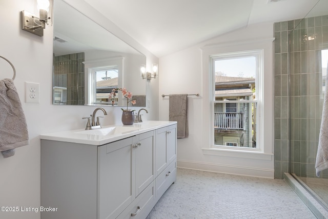 1245 S 7th St, Louisville, KY 40203 - full bath with vaulted ceiling, double vanity, baseboards, and tiled shower