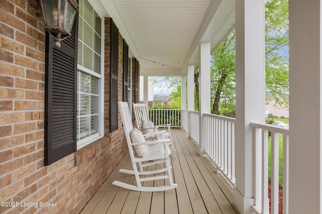 wooden deck featuring covered porch