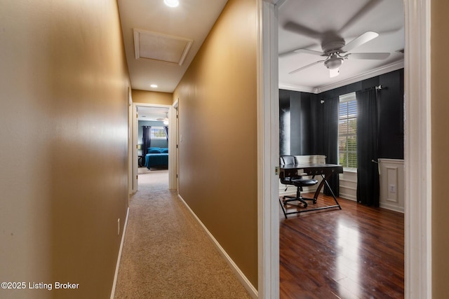 corridor featuring ornamental molding, baseboards, recessed lighting, and wood finished floors