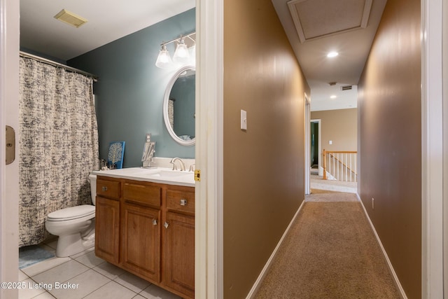 bathroom featuring vanity, toilet, visible vents, and tile patterned flooring