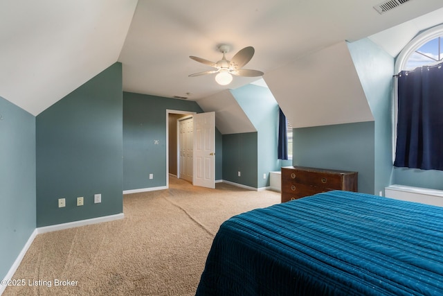 carpeted bedroom with lofted ceiling, baseboards, and visible vents