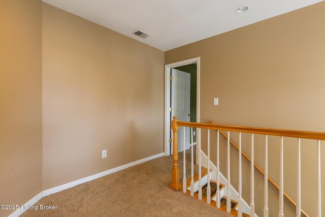 unfurnished room featuring carpet flooring, visible vents, baseboards, and recessed lighting
