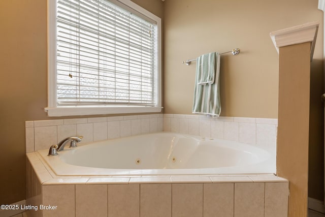 full bathroom with a tub with jets