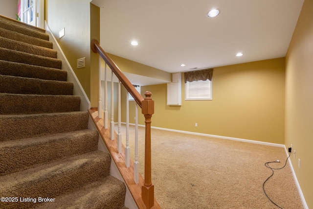 stairs featuring carpet, visible vents, baseboards, and recessed lighting