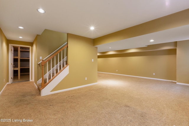 finished basement with carpet floors, baseboards, and recessed lighting