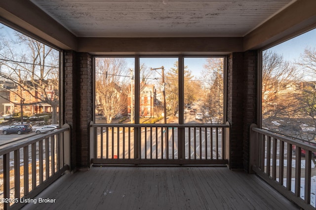 unfurnished sunroom featuring plenty of natural light