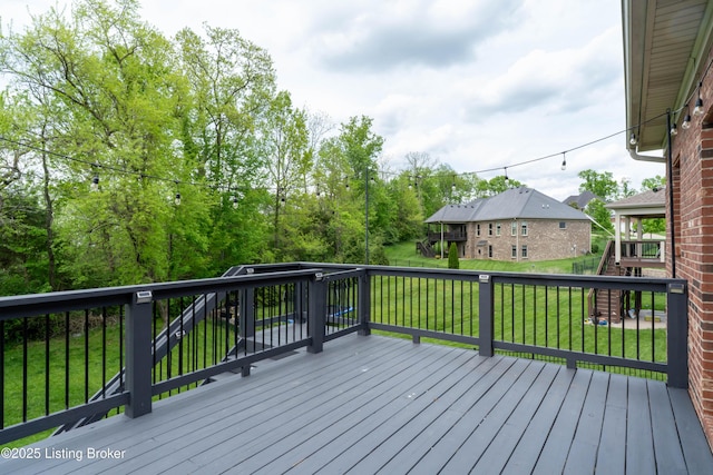 deck featuring a lawn