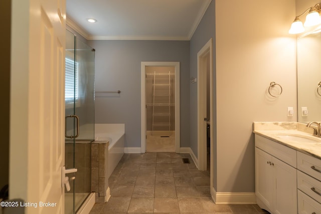 full bathroom featuring ornamental molding, a stall shower, a spacious closet, vanity, and a bath