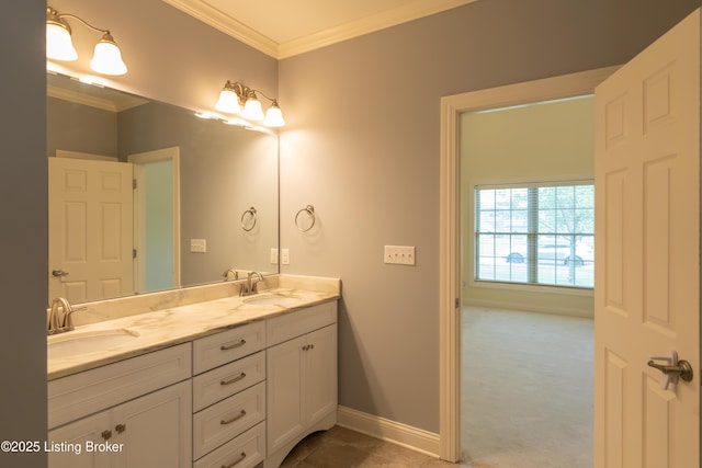 full bathroom featuring double vanity, baseboards, ornamental molding, and a sink