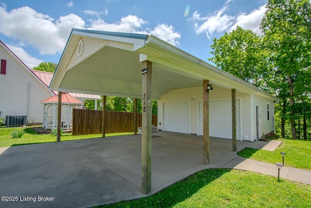 view of vehicle parking featuring a detached garage