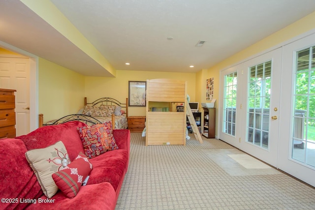 living area with carpet floors, french doors, and recessed lighting