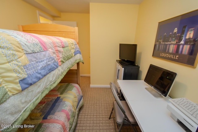 bedroom featuring carpet floors and baseboards