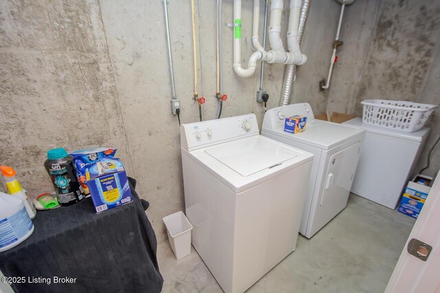 laundry area with washing machine and clothes dryer